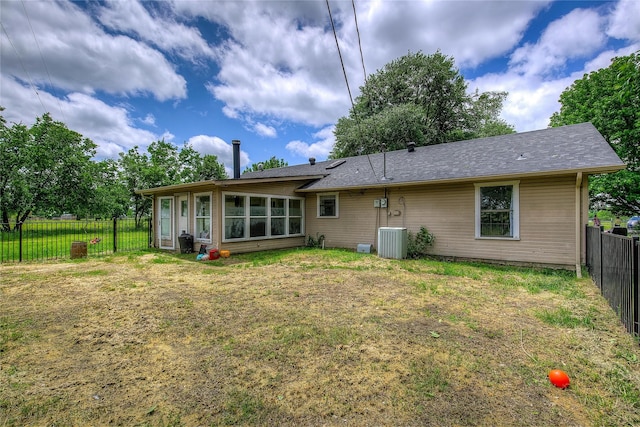 1829 County Road 1103, Sulphur Springs, TX 75482 - rear view of property featuring central AC unit and a sunroom