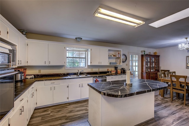 1829 County Road 1103, Sulphur Springs, TX 75482 - kitchen with stainless steel fridge with ice dispenser, a chandelier, light wood finished floors, and white cabinets