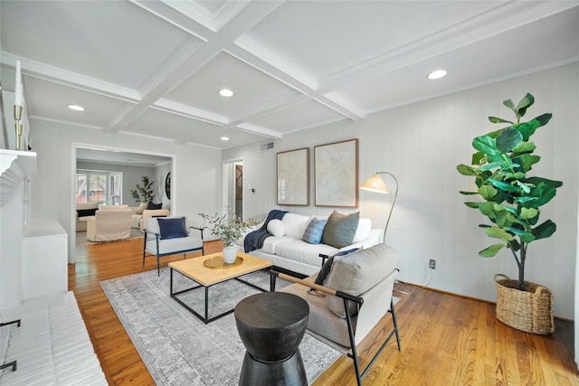 living room with beam ceiling, visible vents, wood finished floors, and coffered ceiling
