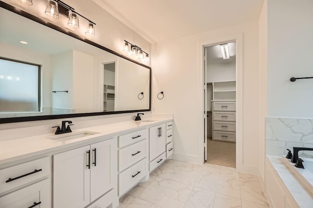 16090 Inca Dove Ct, Frisco, TX 75035 - full bath with marble finish floors, double vanity, a walk in closet, and a tub