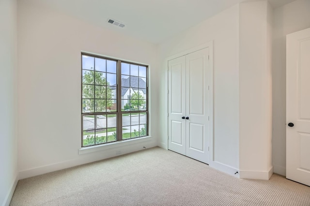16090 Inca Dove Ct, Frisco, TX 75035 - unfurnished bedroom featuring light colored carpet, baseboards, and a closet