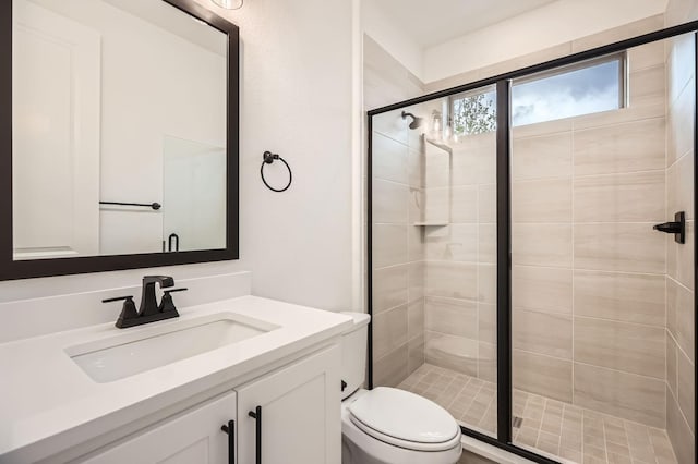16090 Inca Dove Ct, Frisco, TX 75035 - full bath featuring a stall shower, toilet, and vanity