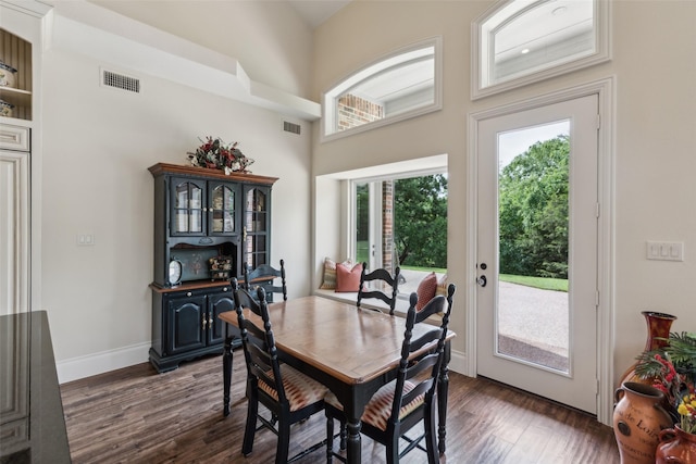 7307 Stallion Cir, Flower Mound, TX 75022 - dining space with a towering ceiling, baseboards, dark wood-type flooring, and visible vents