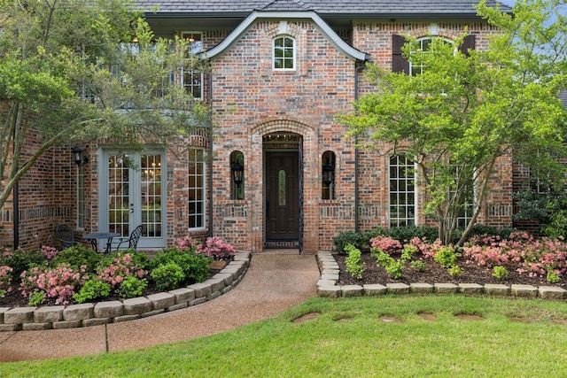 7307 Stallion Cir, Flower Mound, TX 75022 - view of front of home featuring brick siding, a high end roof, and french doors
