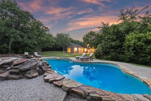 7307 Stallion Cir, Flower Mound, TX 75022 - pool at dusk featuring a patio and an outdoor pool