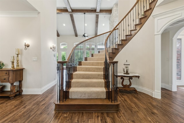 7307 Stallion Cir, Flower Mound, TX 75022 - stairs with ceiling fan, arched walkways, beam ceiling, wood finished floors, and baseboards
