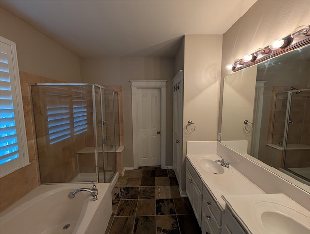 bathroom featuring a sink and a shower stall