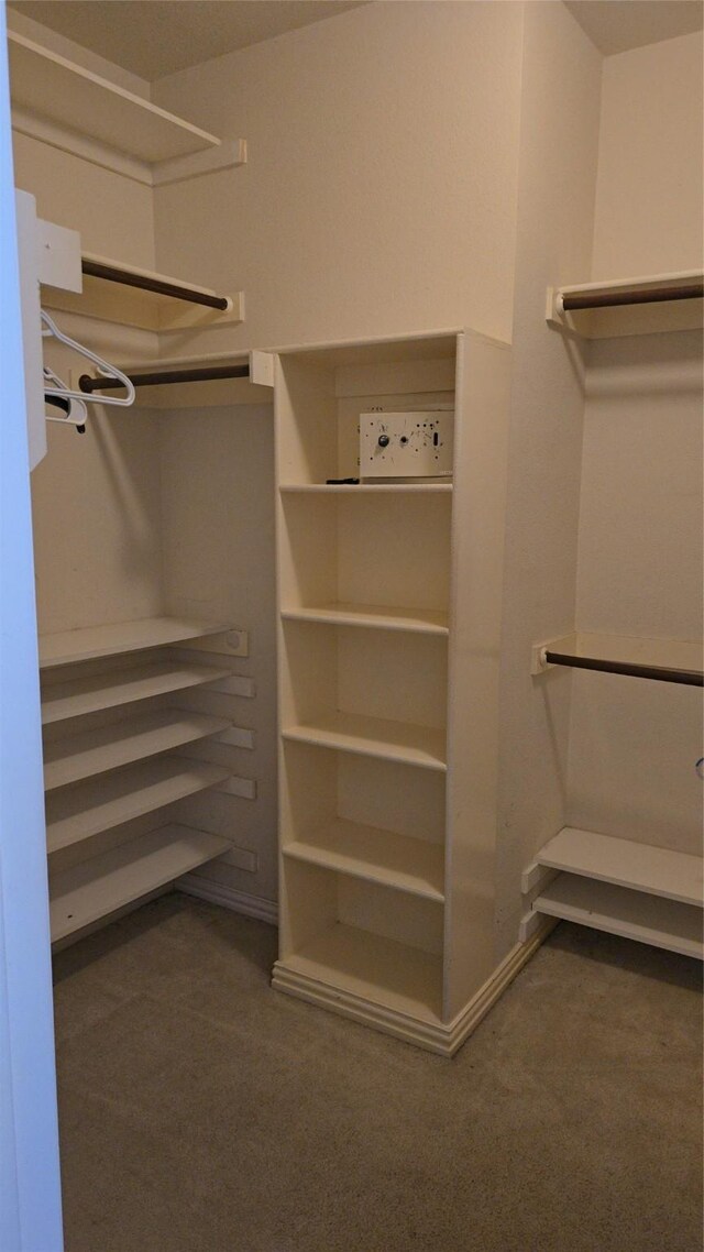 1264 Carriage Creek Dr, Desoto, TX 75115 - walk in closet featuring dark carpet