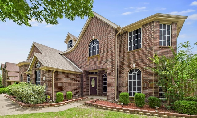1264 Carriage Creek Dr, Desoto, TX 75115 - view of front of house with brick siding and roof with shingles