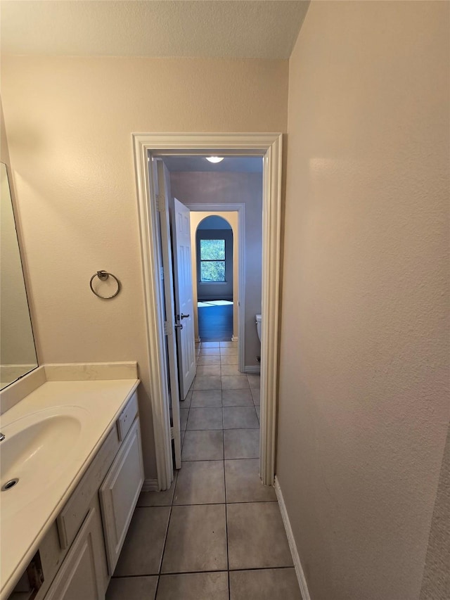 1264 Carriage Creek Dr, Desoto, TX 75115 - bathroom featuring vanity, tile patterned floors, toilet, and baseboards
