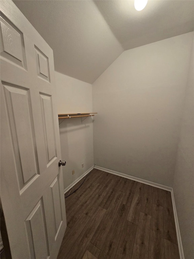 1264 Carriage Creek Dr, Desoto, TX 75115 - walk in closet featuring vaulted ceiling and dark wood finished floors