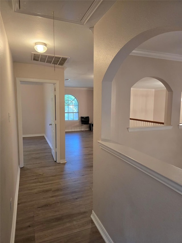 1264 Carriage Creek Dr, Desoto, TX 75115 - corridor featuring dark wood-type flooring, ornamental molding, baseboards, and attic access