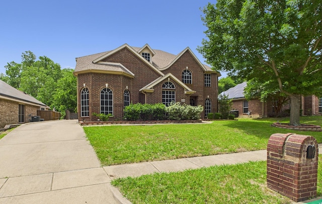 1264 Carriage Creek Dr, Desoto, TX 75115 - view of front of house with brick siding and a front lawn