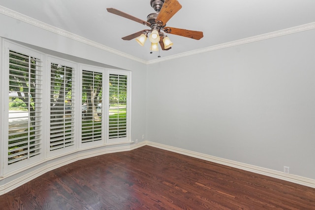 spare room with crown molding, baseboards, ceiling fan, and wood finished floors