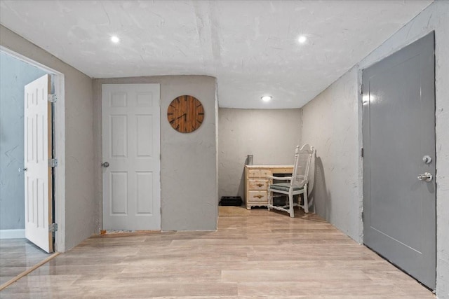 unfurnished office with recessed lighting and wood finished floors