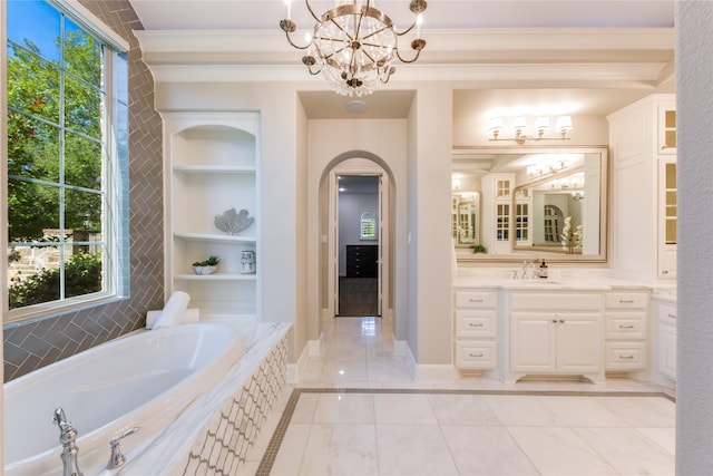 5409 Twin Cities Ln, Mckinney, TX 75070 - full bath featuring a chandelier, built in shelves, a bath, vanity, and crown molding