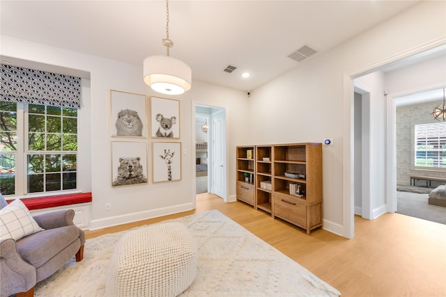 5409 Twin Cities Ln, Mckinney, TX 75070 - sitting room featuring plenty of natural light, light wood-style flooring, and baseboards