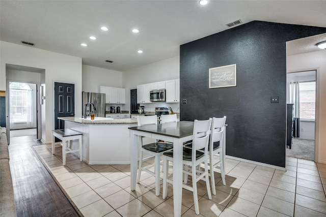 dining area with light tile patterned floors, recessed lighting, and visible vents