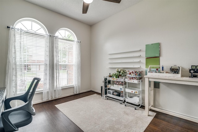 office area with a textured ceiling, ceiling fan, and wood finished floors