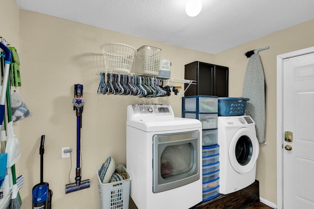 608 Timothy Dr, Fort Worth, TX 76028 - laundry area with washer and dryer, a textured ceiling, and laundry area