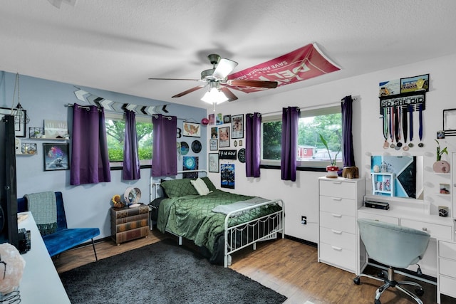 608 Timothy Dr, Fort Worth, TX 76028 - bedroom with a textured ceiling, wood finished floors, ceiling fan, and baseboards