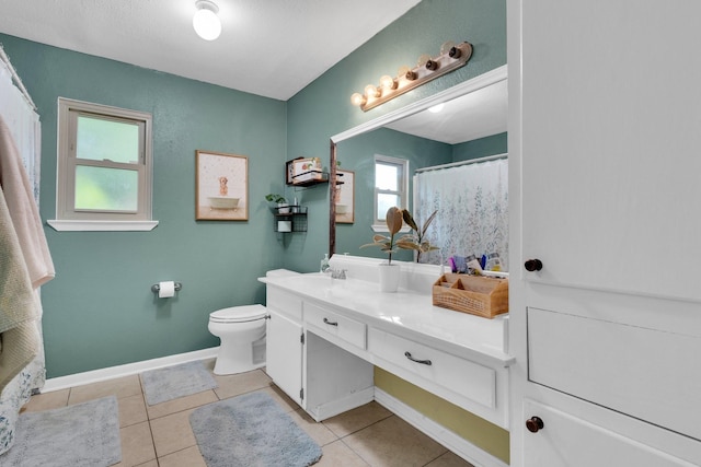 608 Timothy Dr, Fort Worth, TX 76028 - bathroom with toilet, vanity, tile patterned floors, and baseboards