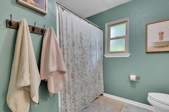 608 Timothy Dr, Fort Worth, TX 76028 - full bath featuring toilet, tile patterned flooring, curtained shower, and baseboards