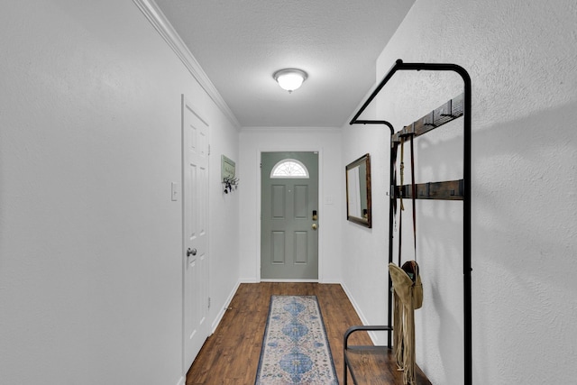608 Timothy Dr, Fort Worth, TX 76028 - entryway with dark wood-type flooring, ornamental molding, a textured ceiling, and baseboards