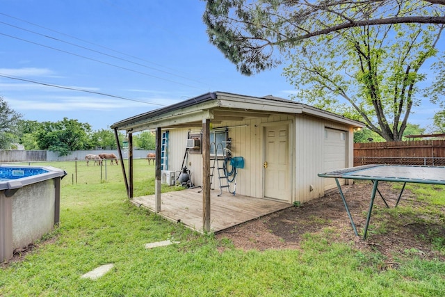 608 Timothy Dr, Fort Worth, TX 76028 - view of outdoor structure with an outbuilding, a fenced in pool, and a fenced backyard