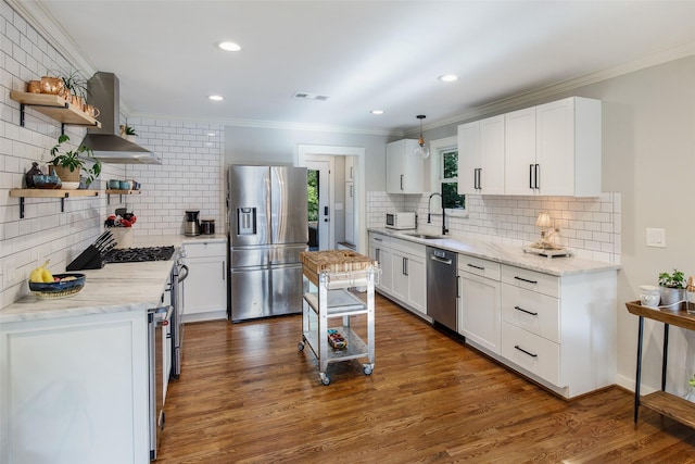 607 Parker St, Mckinney, TX 75069 - kitchen featuring appliances with stainless steel finishes, open shelves, a sink, decorative backsplash, and ornamental molding