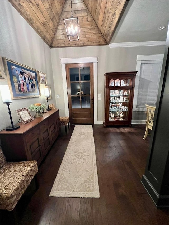 entryway featuring baseboards, wooden ceiling, vaulted ceiling, dark wood-type flooring, and a notable chandelier