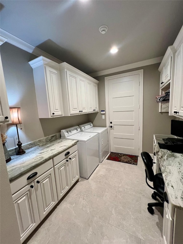 laundry area with washer and dryer, crown molding, and cabinet space
