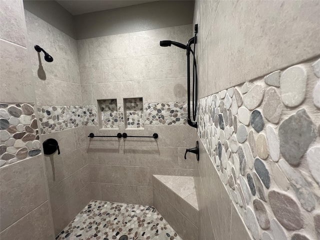 full bathroom with a tile shower