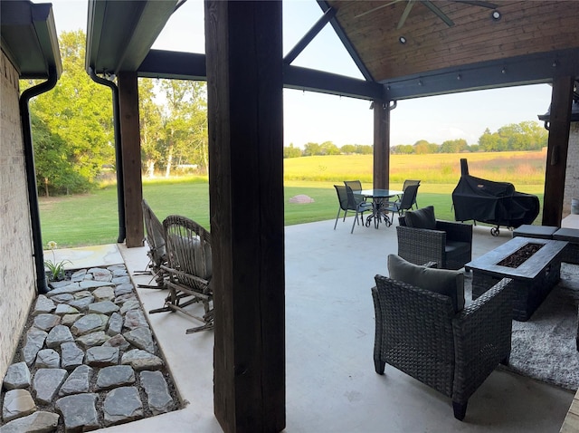 view of patio / terrace featuring a fire pit, a gazebo, and outdoor dining space