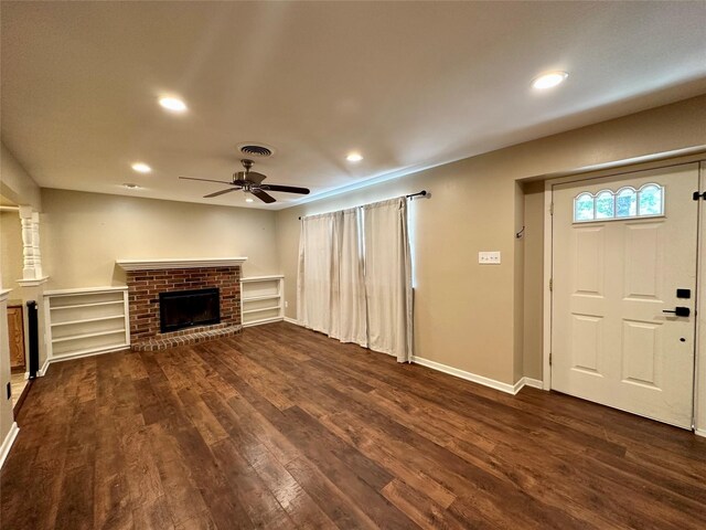 2804 Hollywood Dr, Arlington, TX 76013 - unfurnished living room with visible vents, ceiling fan, recessed lighting, a brick fireplace, and dark wood-type flooring