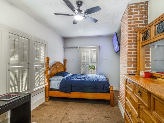 bedroom with carpet floors, baseboards, and multiple windows