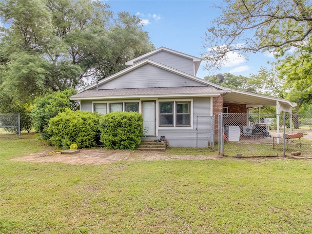 view of home's exterior featuring fence, roof with shingles, an attached carport, entry steps, and a yard