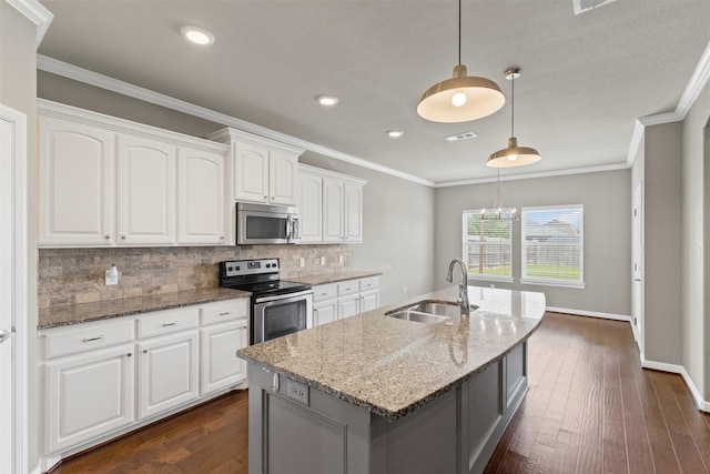 kitchen with tasteful backsplash, light stone counters, stainless steel appliances, a sink, and dark wood-type flooring