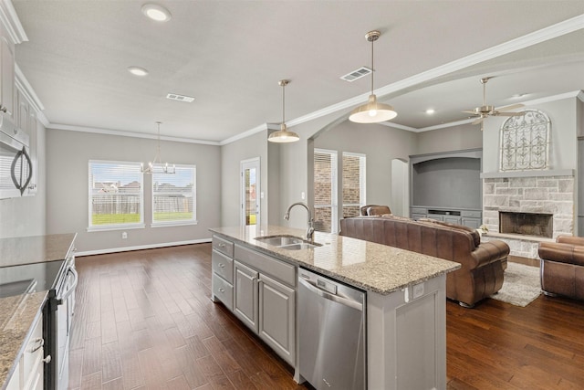 kitchen with dark wood-style floors, visible vents, appliances with stainless steel finishes, and a sink
