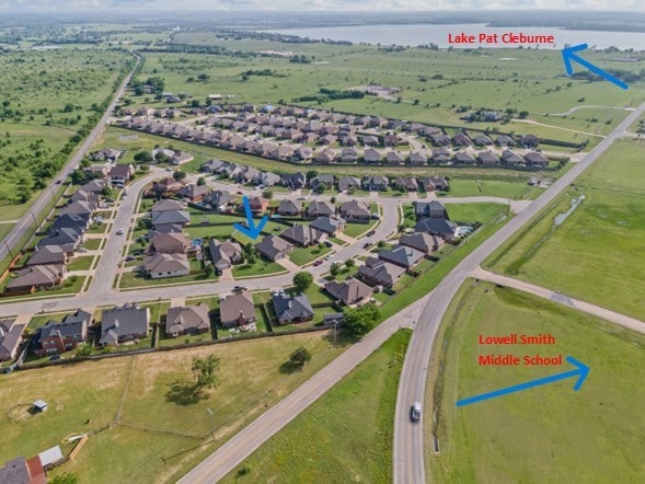 drone / aerial view featuring a residential view and a water view