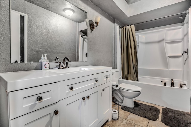 bathroom featuring a textured wall, vanity, toilet, tile patterned floors, and shower / tub combo