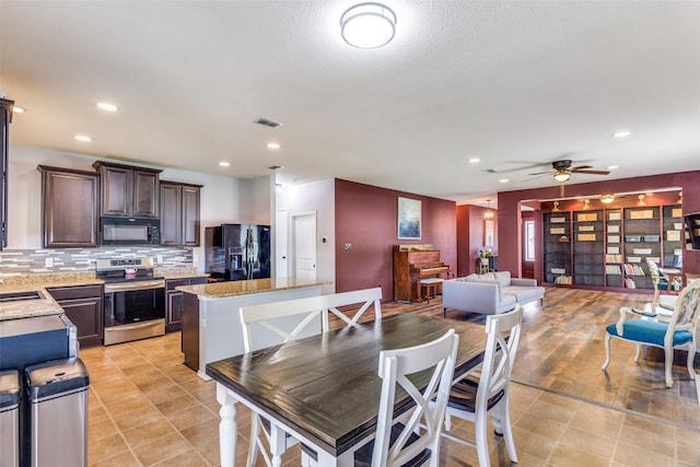 dining room with ceiling fan, recessed lighting, and light tile patterned floors