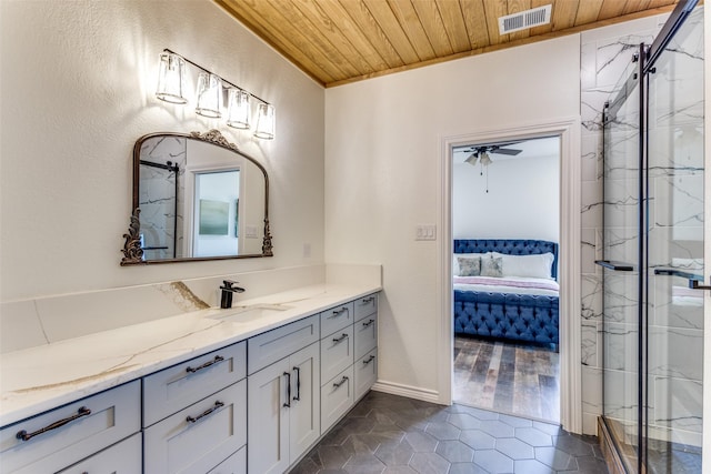 bathroom featuring wood ceiling, tile patterned floors, a marble finish shower, ensuite bathroom, and vanity