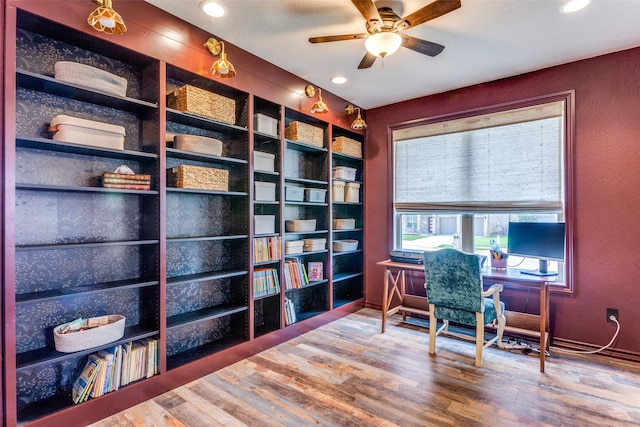 office space featuring wood finished floors, a ceiling fan, and recessed lighting