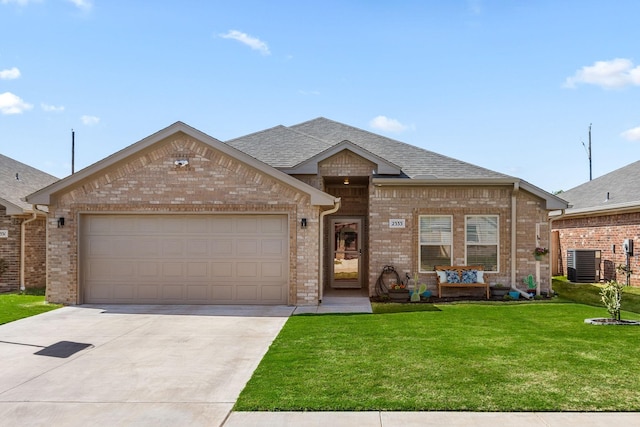 view of front facade with central AC, brick siding, and driveway