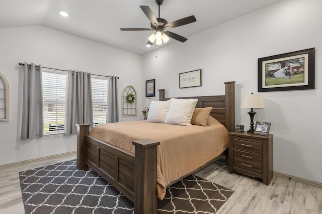 bedroom featuring lofted ceiling, light wood-style floors, baseboards, recessed lighting, and a ceiling fan