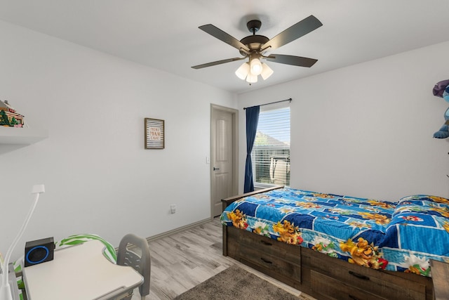 bedroom featuring a ceiling fan and wood finished floors