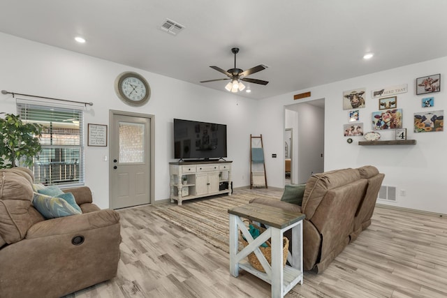 living room with wood finished floors, visible vents, ceiling fan, and recessed lighting
