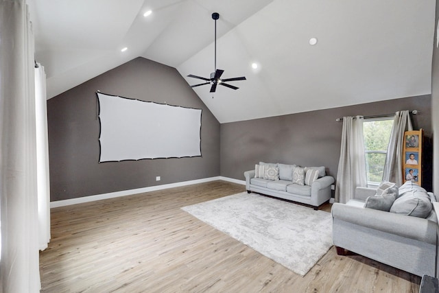home theater room featuring a ceiling fan, recessed lighting, wood finished floors, and lofted ceiling