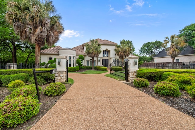 view of property's community featuring a gate and a fenced front yard
